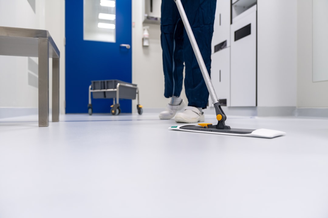 Services-03 Cleaner cleaning the floor in a laboratory environment